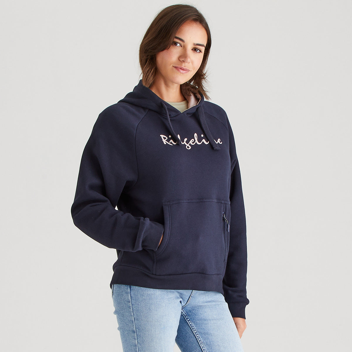 Person wearing a navy hoodie with text on a plain background