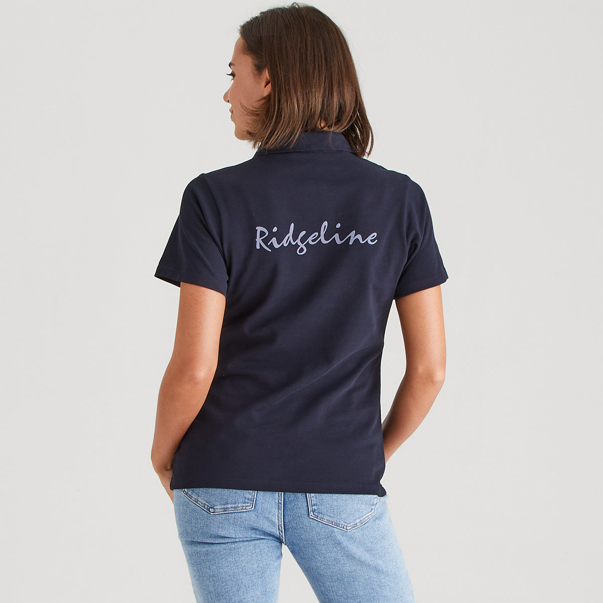 Person wearing a navy blue shirt with 'Ridgeline' branding on the back, standing against a plain background.